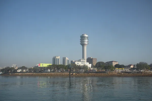 The Dar es Salaam waterfront with city buildings across the water.